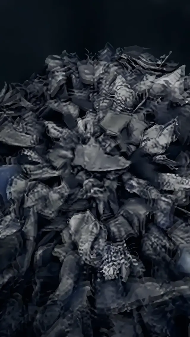 Shredded scrap waste in an industrial bin